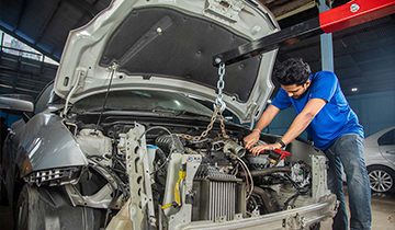 A man fixing at car Mr. Paint Auto