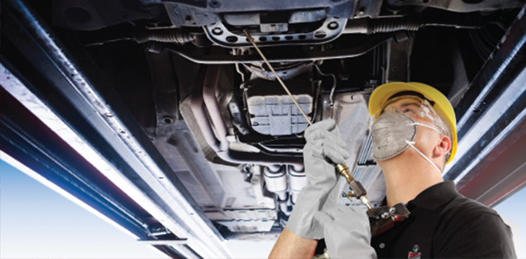 A mechanic working at Mr. Paint Auto